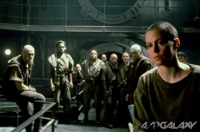 The prisoners look on Ripley.