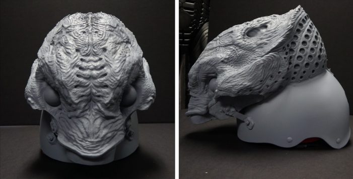 The unpainted 3D printed upper head of the Feral Predator mounted to a helmet.