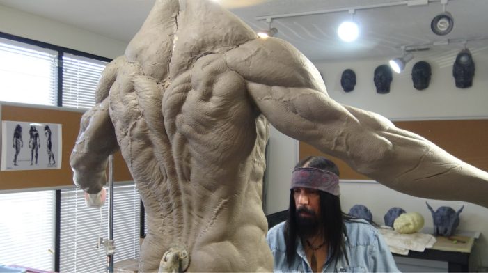 Joey Orosco roughs out the Feral Predator body sculpture.