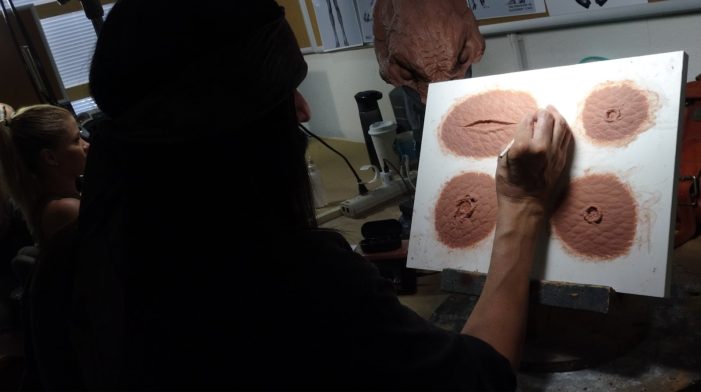 Joey Orosco sculpts a variety of wounds for the Feral Predator.